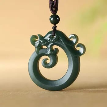 Artisan-crafted Chinese jade dragon pendant on dark background, showcasing intricate details for a sophisticated men's jewelry accessory.