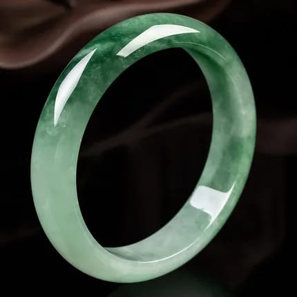 Green jade bangle with black background