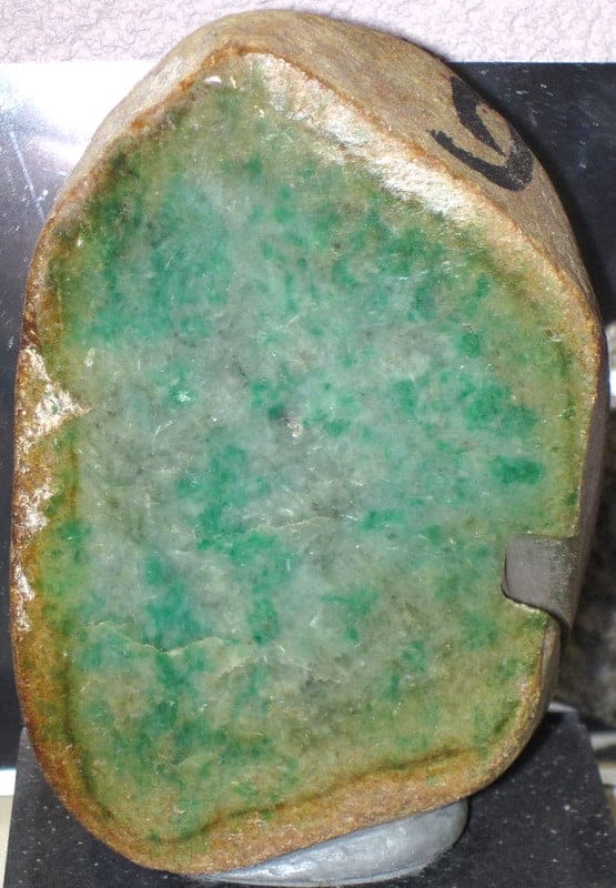 A raw Burmese jadeite stone, showing beautiful green color.