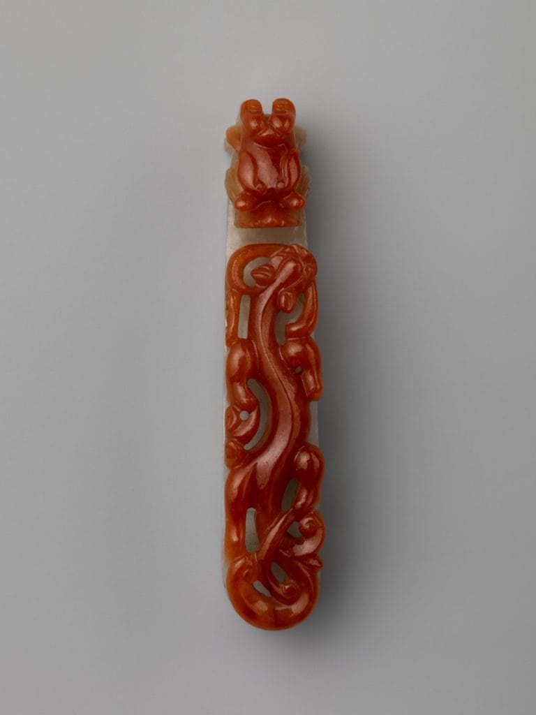 Red and white jade carving. Qing dynasty era. Shows the impressive contrast of different jade color in a single stone.