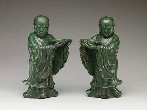 Green jade temple attendant carvings.