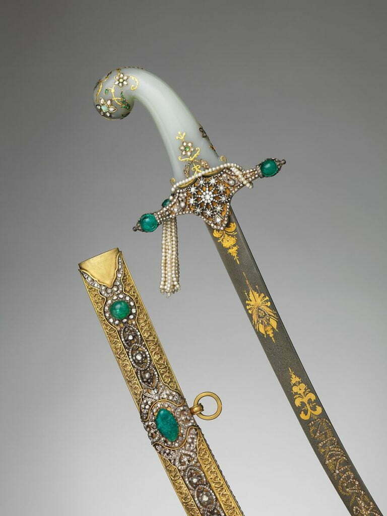 An antique scepter, adorned with a white jade handle